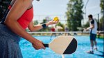 A group of pickleball players playing a round of doubles on the pickleball court