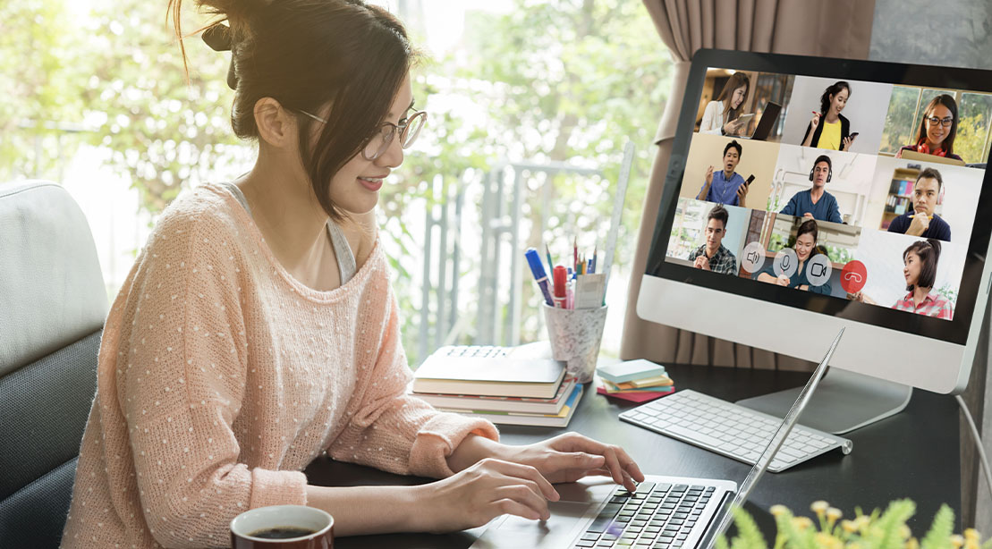 Asian female in a hybrid work situation while on a zoom meeting