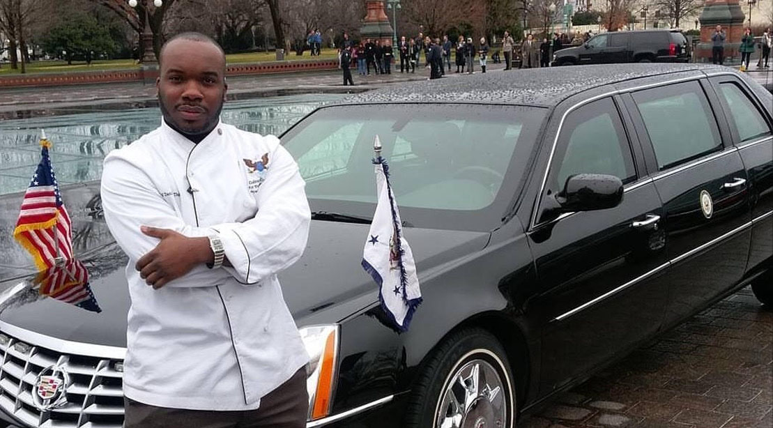 Chef Daniel Thomas standing in front of the presidential limo