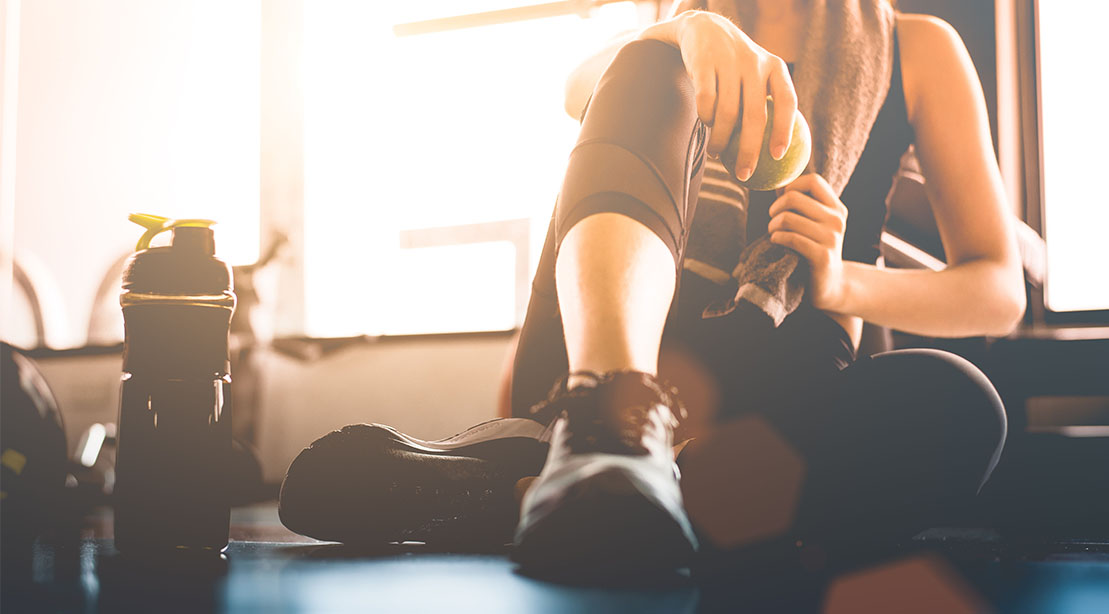 Female recovering after a hard workout in the gym