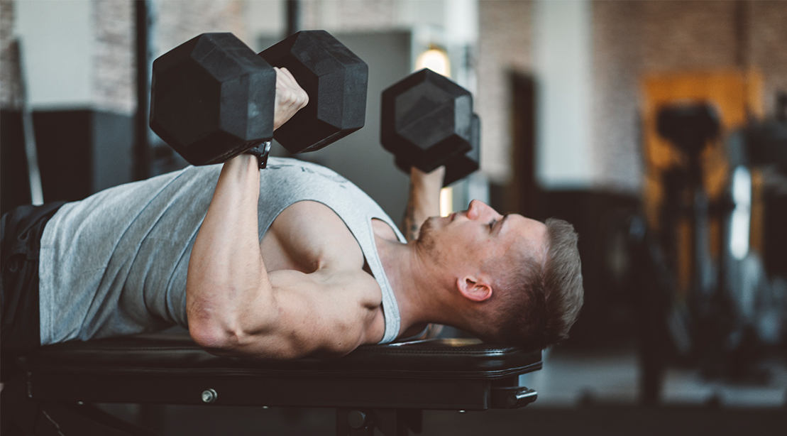 Ma doing dumbbell shoulder workouts with the dumbbell bench press exercise