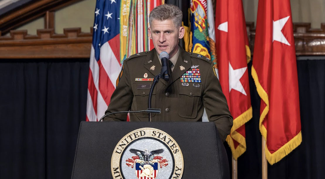 Nick Gist in uniform giving a speech