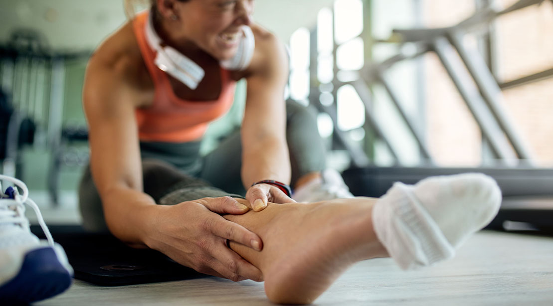 Woman suffering from an ankle sprain a common gym injury